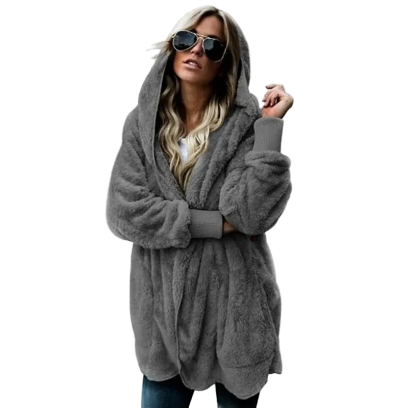 Woman wearing a gray hooded coat on a white background