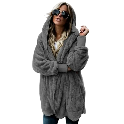 Woman wearing a gray hooded coat on a white background