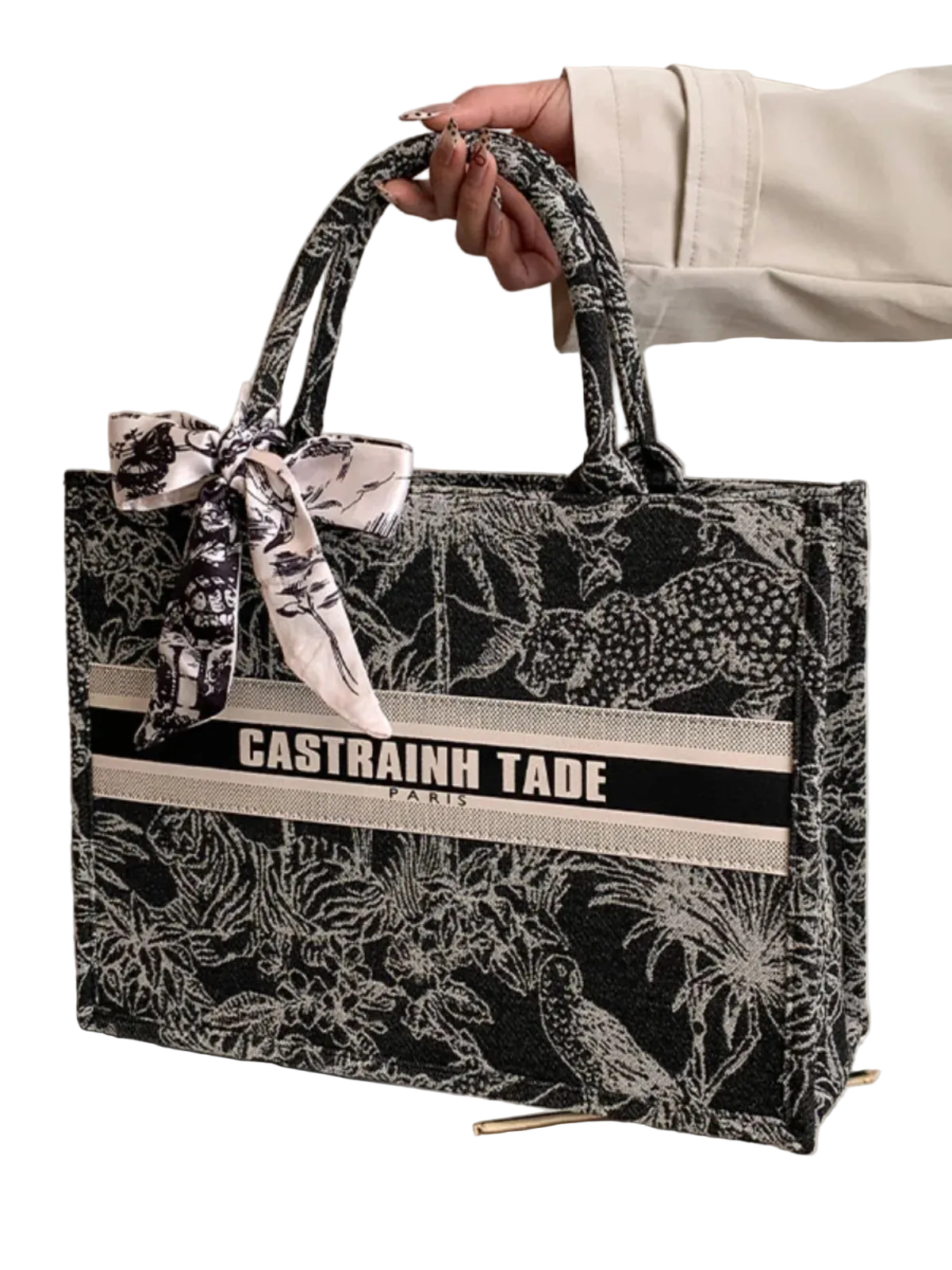 Handbag with floral pattern and visible brand name on a white background