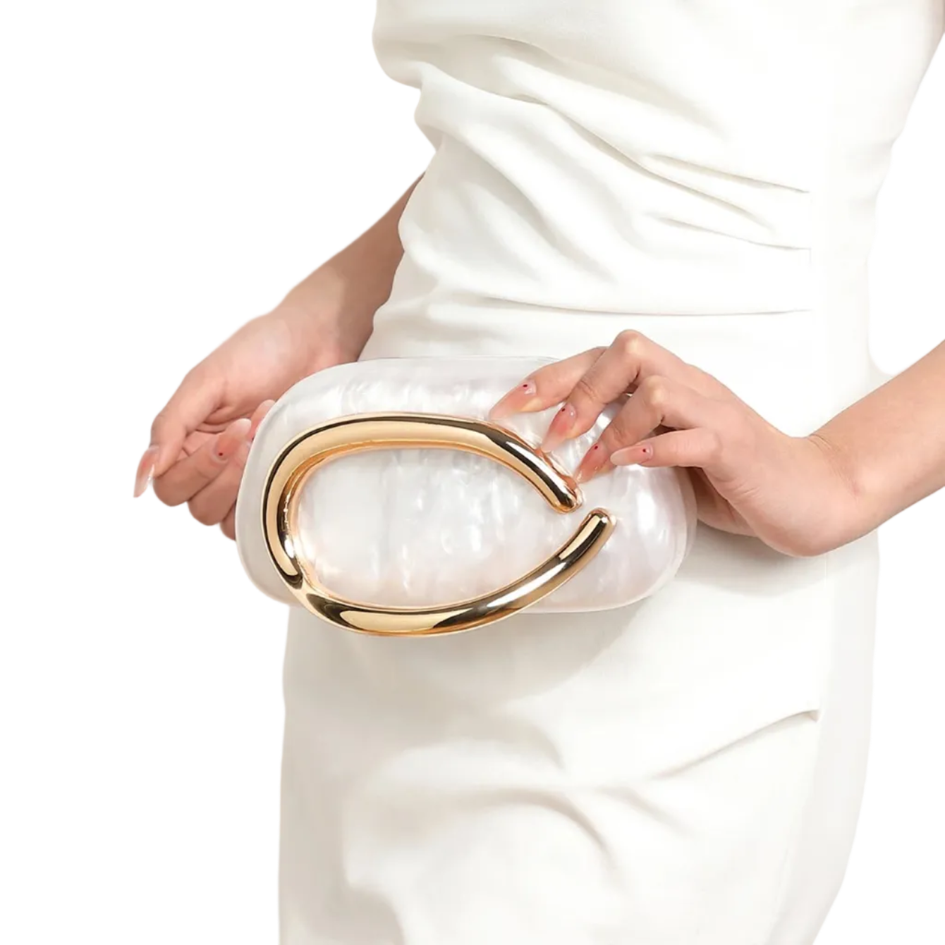 White clutch with gold accents held by a person wearing a white dress.