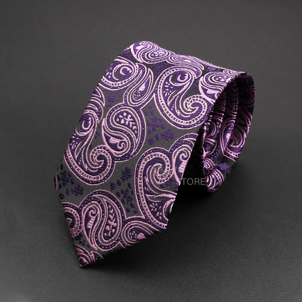 Purple paisley patterned tie on a dark gray background