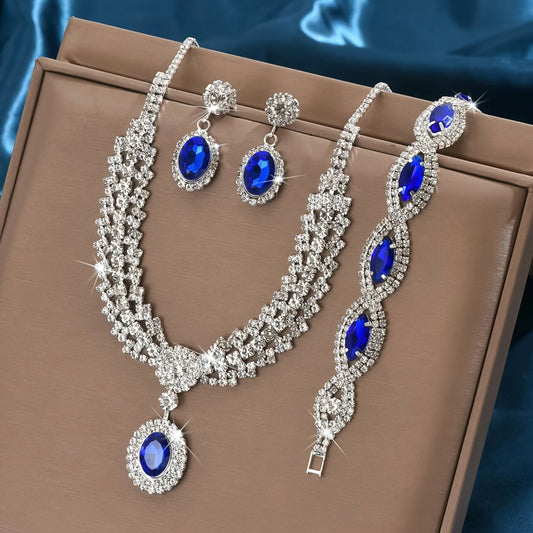 timeless_jewelry_set_from_Carauana with necklace, bracelet, and earrings featuring blue stones